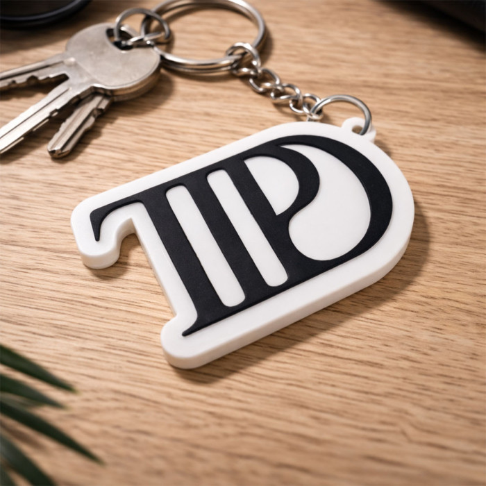 Porte-clé TTPD noir & blanc – Accessoire inspiré de l’ère TTPD
