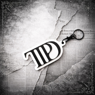 Porte-clé TTPD noir & blanc – Accessoire inspiré de l’ère TTPD